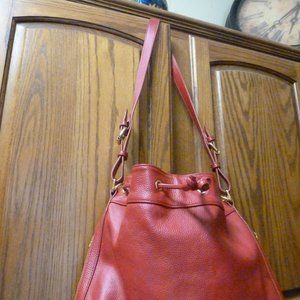 Red pebbled leather Ora Delphine Claire Bucket Bag